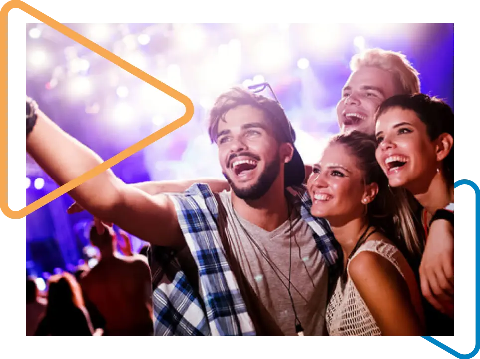 Group of friends taking a picture at a concert.